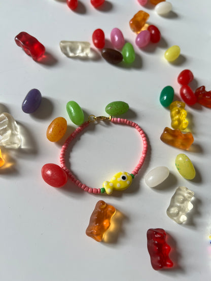 Bird's Eye View of Bracelets . Featuring Ceramic Fish Beads in yellow fish and pink  beads