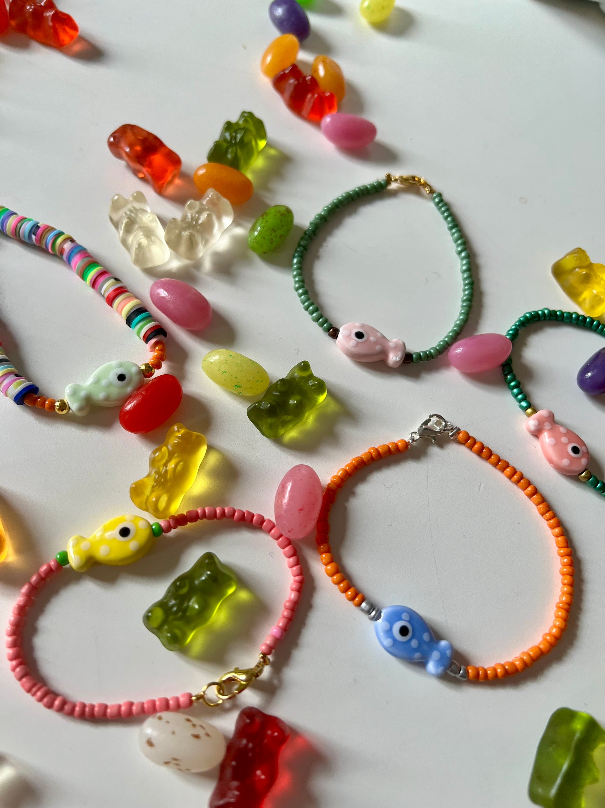 Bird's Eye View of Bracelets . Featuring Ceramic Fish Beads in a Variety of Colors